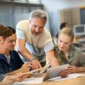 Teacher helping students